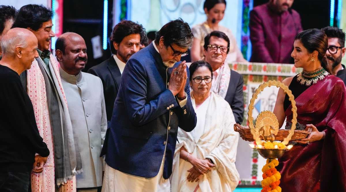 Bollywood actor Amitabh Bachchan inaugurates the at the 24th Kolkata International Film Festival by lighting lamps as Mamata Banerjee, Shah Rukh Khan, Shatrughan Sinha and Mahesh Bhatt attend in Kolkata, India, Thursday, Dec. 15, 2022. The festival will continue till Dec. 22. (AP Photo/Bikas Das)